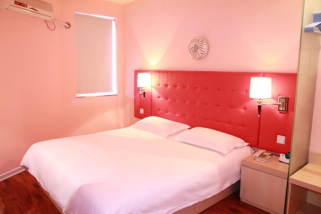 Qingdao Renjia Bussiness Hotel Quarto foto